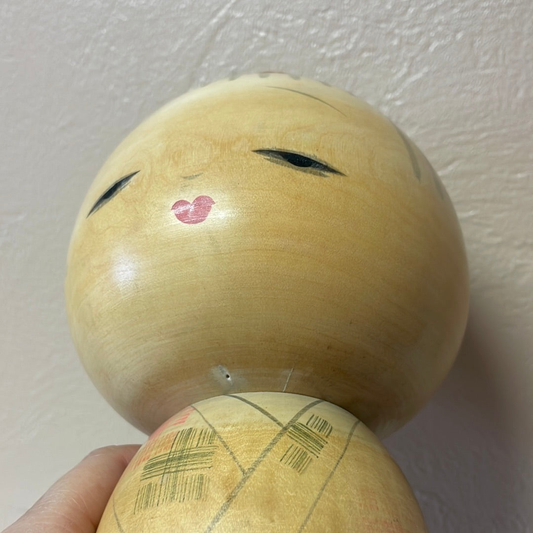 Kokeshi carrying a lantern