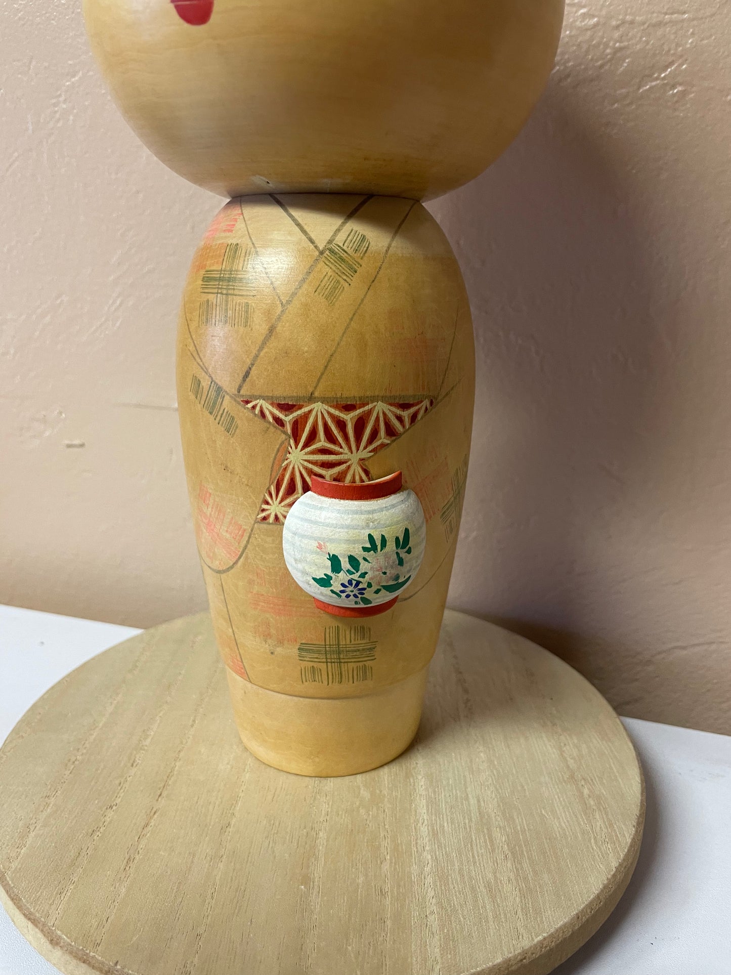 Kokeshi carrying a lantern