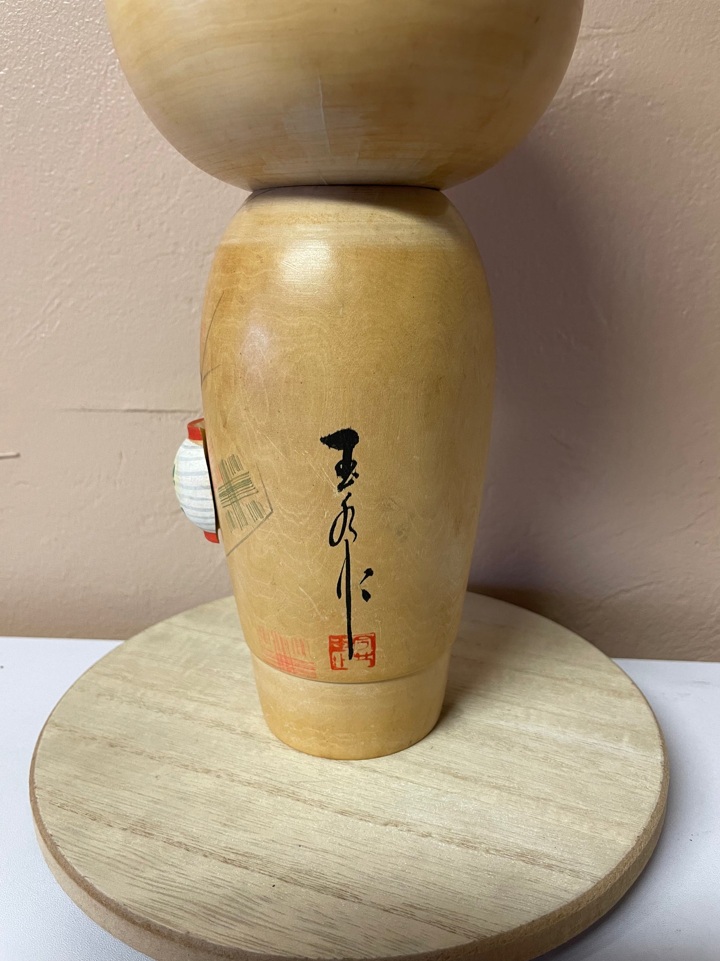 Kokeshi carrying a lantern