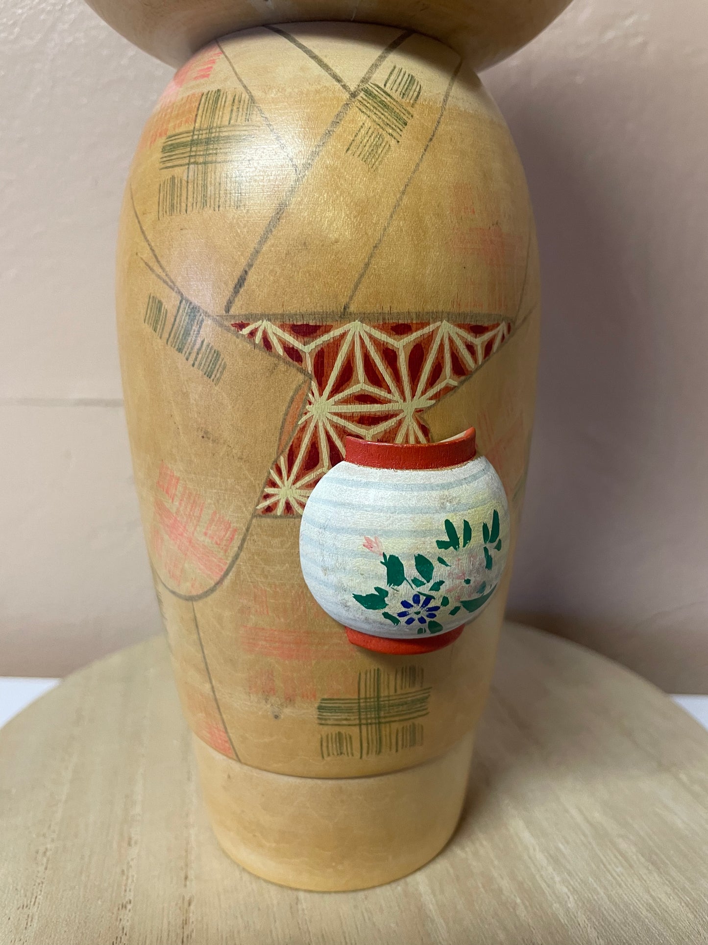 Kokeshi carrying a lantern